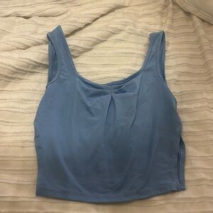 blue cropped tank top with cut outs